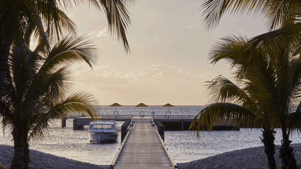 Scenic view of a dock on a sandy beach, a top thing to do in Nevis