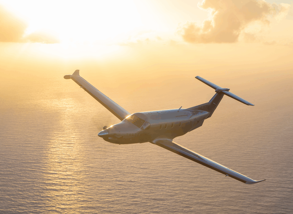 Flights to The Bahamas during orange sunset skies
