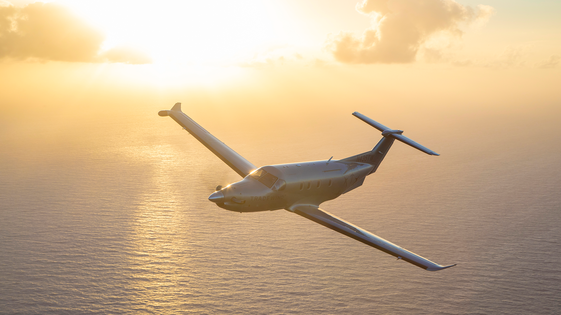 Flights to The Bahamas during orange sunset skies