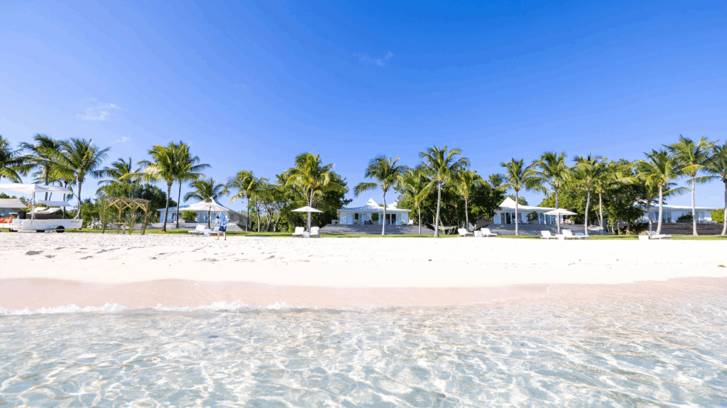 Clear water and white sand beaches at The Cove Eleuthera, available following flights to North Eleuthera.