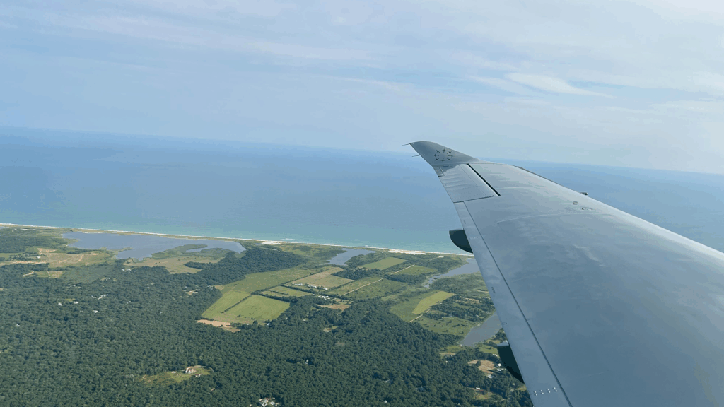 Tradewind plane wing over Martha's Vineyard coastline