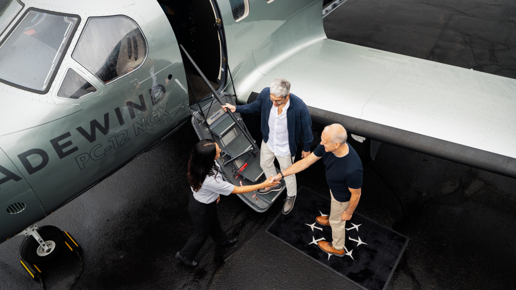 two colleagues boarding a private charter with Tradewind